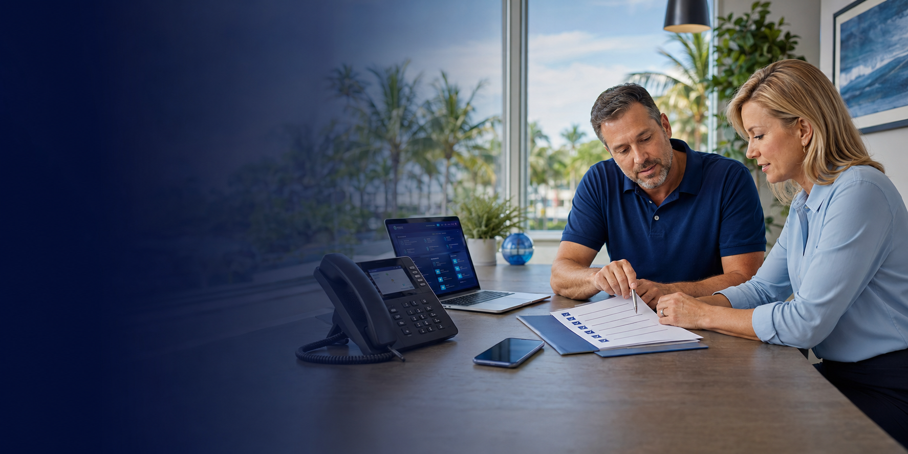 A local Florida telecom consultant reviewing a business phone system checklist with a small-business owner